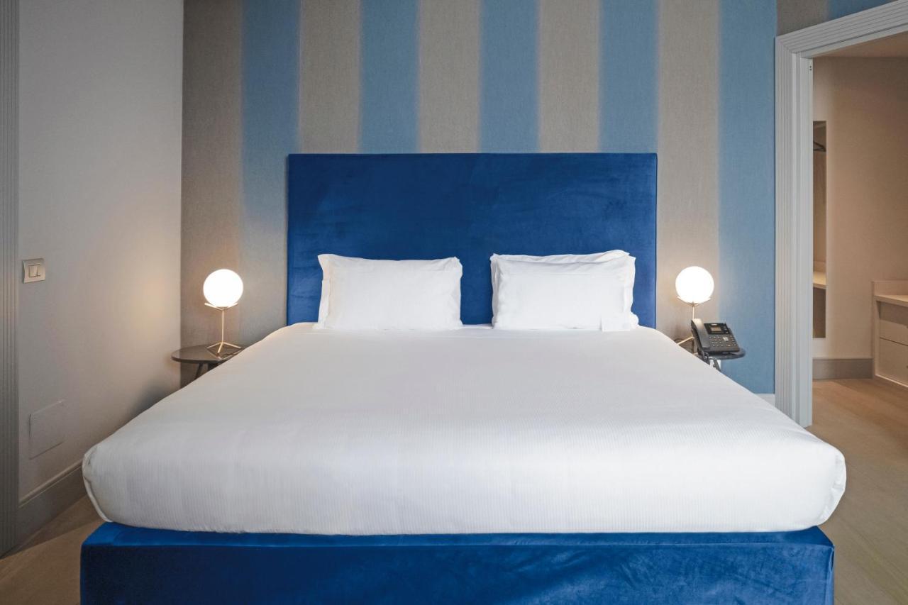 Palazzo Cornalia Hotel Milan Bagian luar foto A bedroom at the hotel