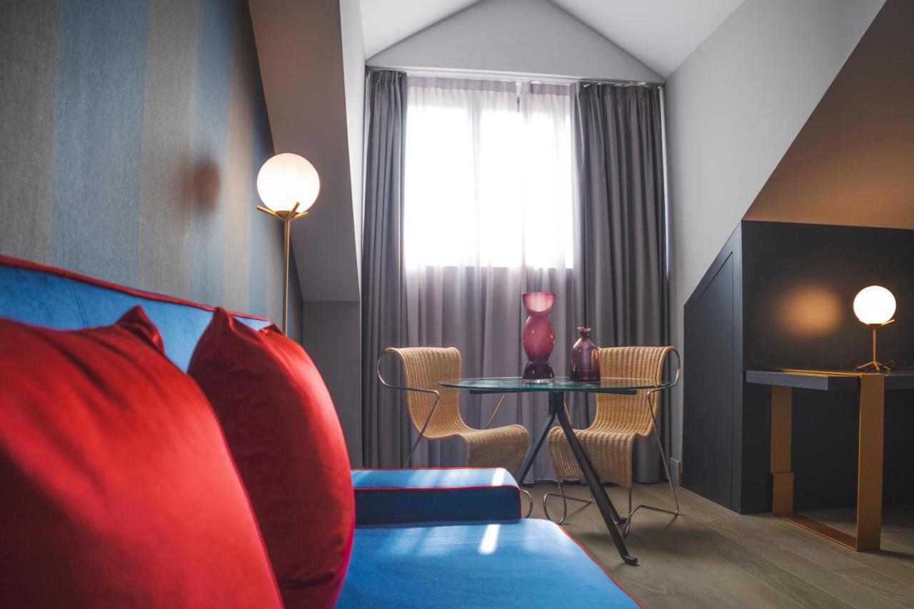 Palazzo Cornalia Hotel Milan Bagian luar foto A room at the hotel
